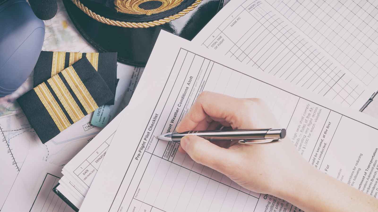 Aerospace executive preparing flight documentation relevant to space sector leadership